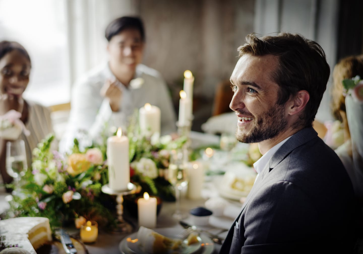 Bride and groom having a meal with friends.