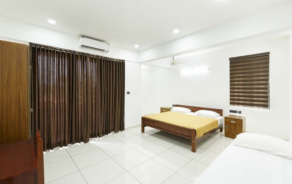 Executive Deluxe Room with wide-angle view of cozy interiors.